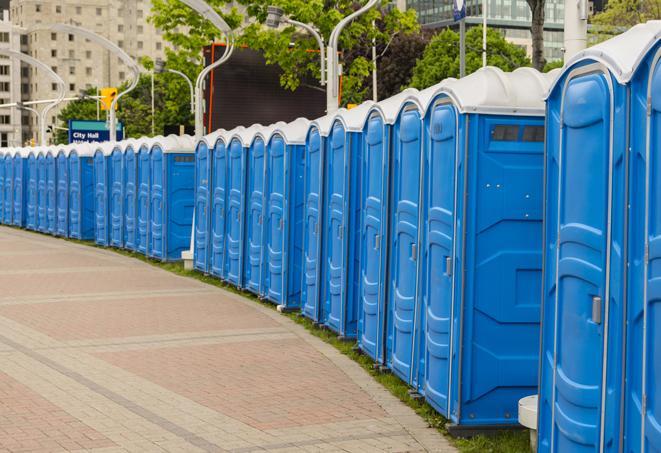 portable restrooms stationed outside of a high-profile event, with attendants available for assistance in East Lansdowne
